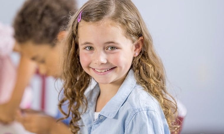 A confident, smiling child