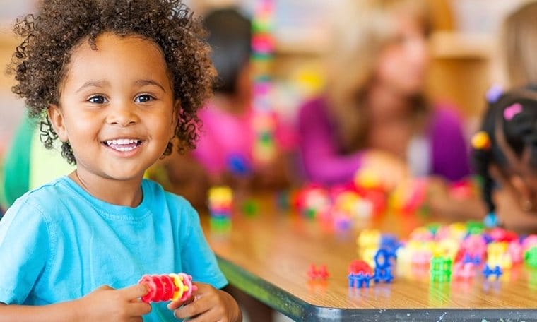 Toddler at an activity table